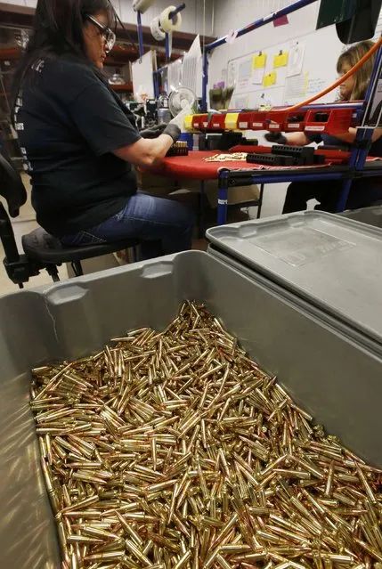 A worker puts finished 300 AAC Blackout rounds into packaging at Barnes Bullets in Mona, Utah, January 6, 2015. (Photo by George Frey/Reuters)