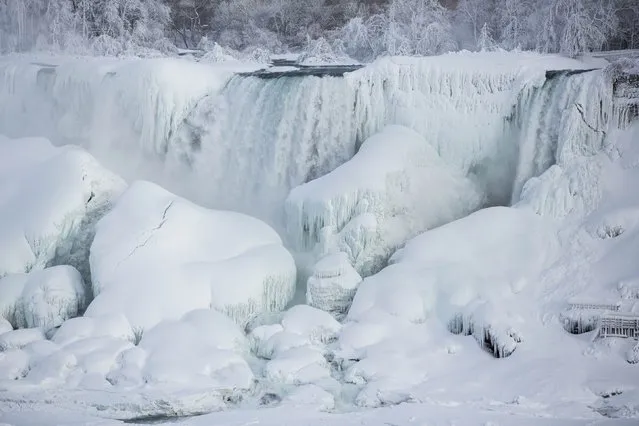 A partially frozen American Falls in sub freezing temperatures is seen in Niagara Falls, Ontario February 17, 2015. Temperature dropped to 6 degrees Fahrenheit (-14 Celsius) on Tuesday. (Photo by Lindsay DeDario/Reuters)