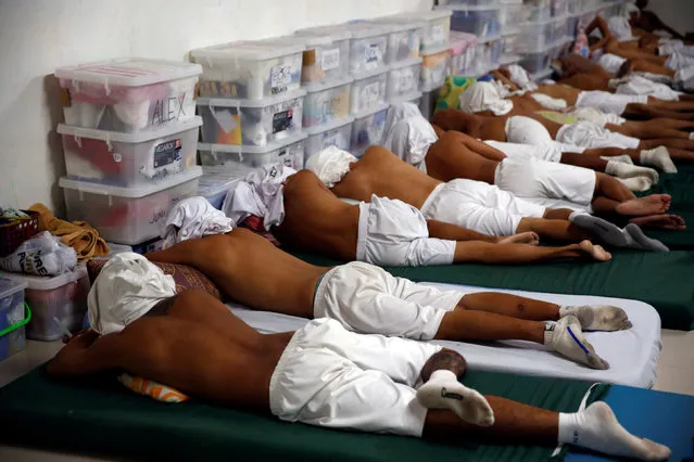 Drug dependents sleep with their shirts over their heads during a siesta at a dormitory for newly admitted patients at Central Luzon Drug Rehabilitation Center in Pampanga province in northern Philippines, October 7, 2016. (Photo by Erik De Castro/Reuters)