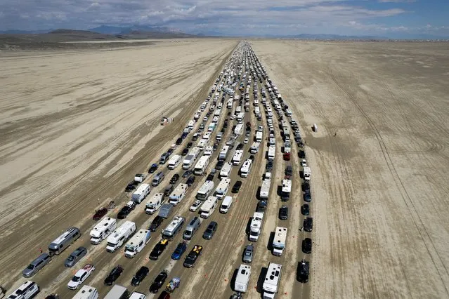 Vehicles are seen departing the Burning Man festival in Black Rock City, Nevada, U.S., September 4, 2023. (Photo by Matt Mills McKnight/Reuters)
