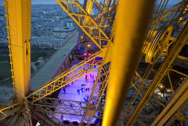 In this February 19, 2017 file photo, people skate on the ice rink set at 57 meters (188 feet) above the ground on the Eiffel Tower in Paris. Tourism to Paris is showing signs of revival after a yearlong slump attributed to deadly extremist attacks, violent labor protests, strikes and floods, according to figures released Tuesday Feb. 21, 2017. (Photo by Michel Euler/AP Photo)