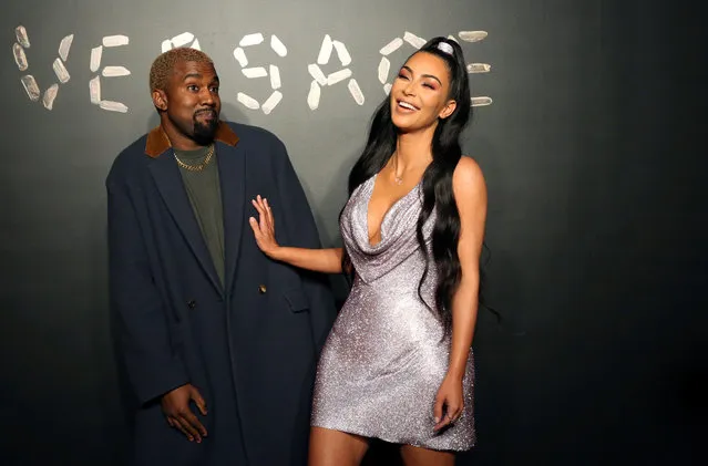 Kanye West and Kim Kardashian pose for a photo before attending the Versace presentation in New York, December 2, 2018. (Photo by Allison Joyce/Reuters)