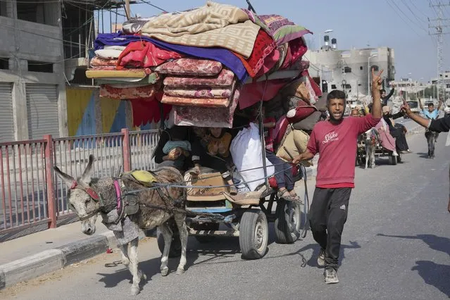 Palestinians flee the southern Gaza Strip on Salah al-Din street in Bureij on Sunday, November 5, 2023. (Photo by Hatem Moussa/AP Photo)
