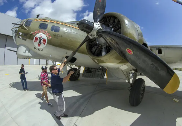 In this August 15, 2017 file photo, Lone Star Flight Museum President Larry Gregory aligns the propellers of the museum's B-17 after landing at the museum's new home at Ellington Airport in Houston. The Galveston building that housed the vintage military aircraft flight museum and was swamped in 2008 during Hurricane Ike has been sold. The Galveston County Daily News reports brothers Billy, John and Todd Sullivan purchased the 100,000-square-foot building formerly home to the Lone Star Flight Museum. (Photo by Stuart Villanueva/The Galveston County Daily News via AP Photo)