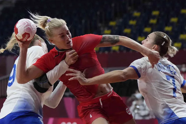 Norway's Veronica Krestiansen makes a shot during the women's semifinal handball match between Norway and Russian Olympic Committee at the 2020 Summer Olympics, Friday, August 6, 2021, in Tokyo, Japan. (Photo by Sergei Grits/AP Photo)