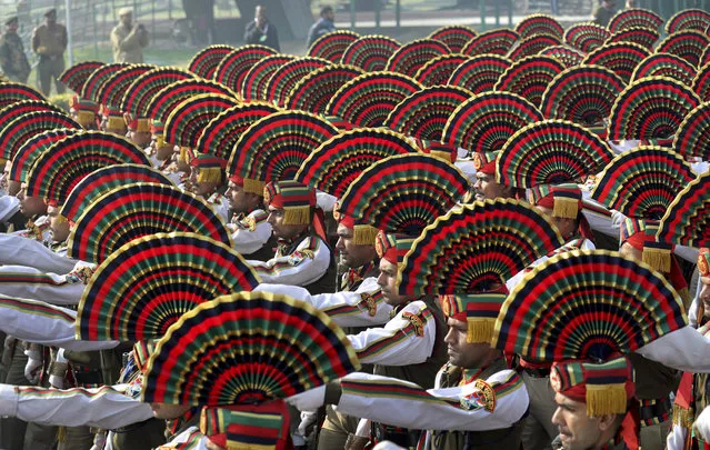 Para-military force soldiers march during the rehearsals for the upcoming Republic Day parade at the Raisina hills, the government seat of power, in New Delhi, India, Friday, January 18, 2019. India celebrates Republic Day on Jan. 26, highlighted by a march past by different branches of the military as well as a display of arms and missiles. (Photo by Manish Swarup/AP Photo)