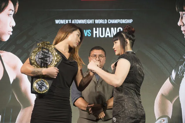 In this January 17, 2017, photo, mixed martial arts ONE Women's Atomweight World Champion Angela Lee, left, poses with challenger, Jenny Huang of Taiwan, at a press conference in Bangkok, Thailand. The head of ONE Championship, Asia's leading mixed martial arts promoter, is aiming to almost triple the current number of events per year as it chases an ambitious expansion agenda. (Photo by ONE Championship via AP Photo)