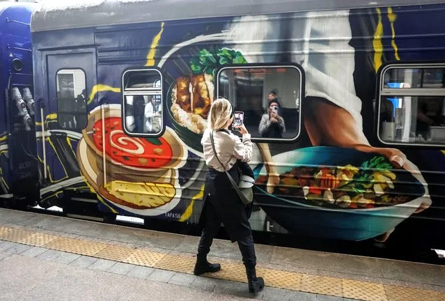 A train-kitchen named Food Train designed to make and distribute up to 70,000 meals a week sets off on its maiden journey from Ukrainian capital to frontline areas in the eastern region, amid Russia's attack on Ukraine, in Kyiv, Ukraine on November 23, 2023. (Photo by Gleb Garanich/Reuters)