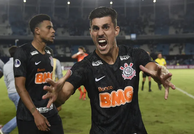Danilo Avelar of Brazil's Corinthians celebrates his team's victory over Argentina's Racing Club at the end of their Copa Sudamericana soccer match in Buenos Aires, Argentina, Wednesday, February 27, 2019. (Photo by Gustavo Garello/AP Photo)