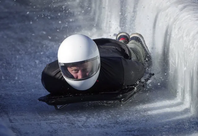Prince Harry, the Duke of Sussex, hits the wall as he slides down the track on a skeleton sled during an Invictus Games training camp, in Whistler, British Columbia, Thursday, February 15, 2024. Invictus Games Vancouver Whistler 2025 is scheduled to take place from Feb. 8-16, 2025. (Photo by Darryl Dyck/The Canadian Press via AP Photo)