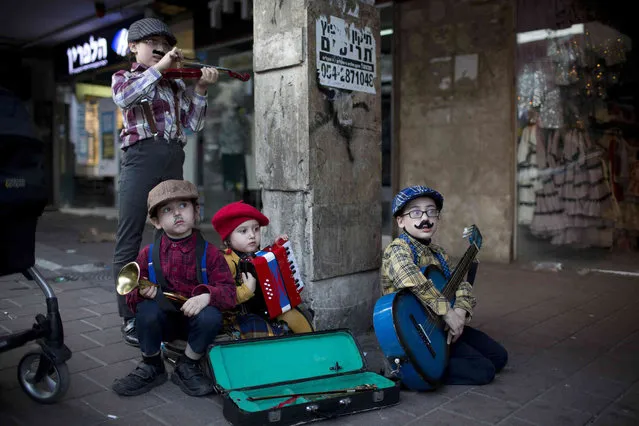 Costumed Jewish Ultra-Orthodox children take part in the Jewish festival of Purim, in Bnei Brak, Israel, Thursday, March 21, 2019. The Jewish holiday of Purim commemorates the Jews' salvation from genocide in ancient Persia, as recounted in the Book of Esther. (Photo by Oded Balilty/AP Photo)