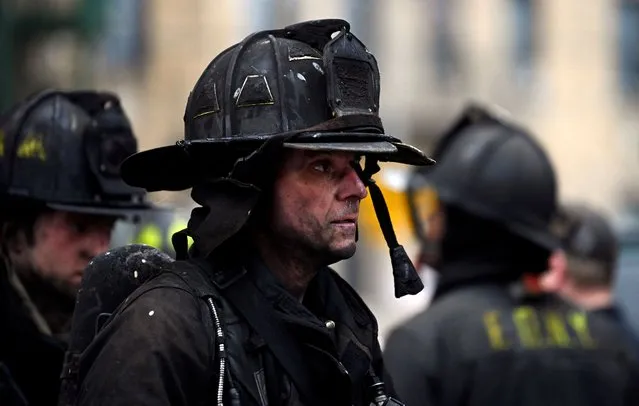 Emergency personnel from the FDNY respond to an apartment building fire in the Bronx borough of New York City, U.S., January 9, 2022. (Photo by Lloyd Mitchell/Reuters)