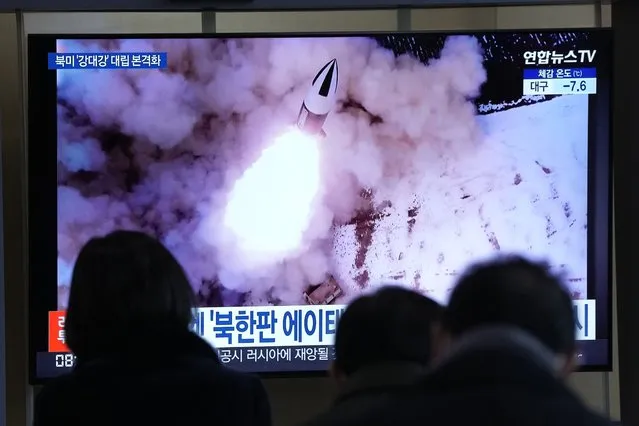 People watch a TV showing a file image of North Korea's missile launch shown during a news program at the Seoul Railway Station in Seoul, South Korea, Thursday, January 20, 2022. Accusing the United States of hostility and threats, North Korea on Thursday said it will consider restarting “all temporally-suspended activities” it had paused during its diplomacy with the Trump administration, in an apparent threat to resume testing of nuclear explosives and long-range missiles. (Photo by Ahn Young-joon/AP Photo)