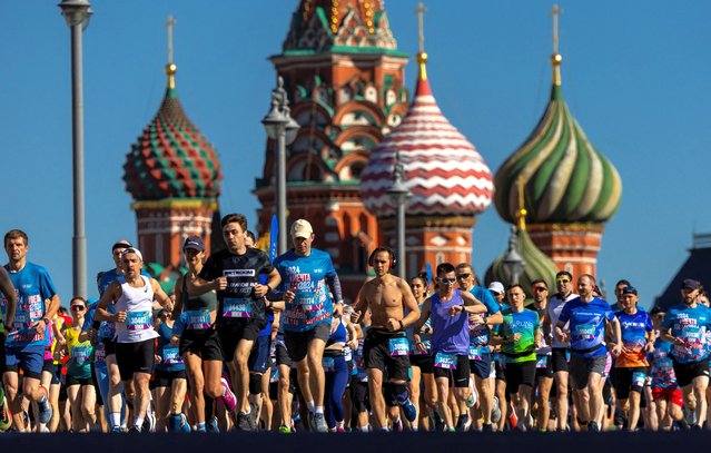 People run in front of St. Basil’s Cathedral during a running festival in Moscow, Russia, on May 19, 2024. (Photo by Maxim Shemetov/Reuters)