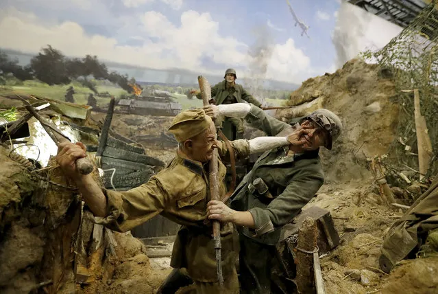A scene showing one of the first trench battles is prepared for the opening of the 3D Panorama exhibition “Memory talks. The road through war” in the former Sevcabel port in St. Petersburg, Russia, 16 September 2019. (Photo by Anatoly Maltsev/EPA/EFE)