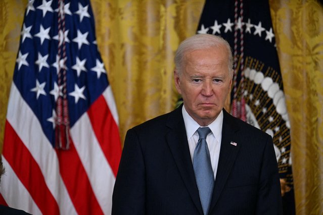 US President Joe Biden looks on during a Medal of Honor ceremony in the East Room of the White House in Washington, DC, on July 3, 2024. (Photo by Jim Watson/AFP Photo)