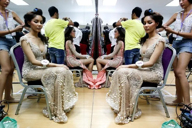 Beauty contestants prepare backstage before the final of the annual Miss Tiffany's Universe 2016 transvestite contest in the beach resort town of Pattaya, Thailand, May 13, 2016. (Photo by Athit Perawongmetha/Reuters)