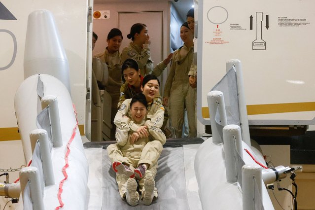 Starlux flight attendants receive emergency landing and slide trainings at their center in Taoyuan, Taiwan on April 12, 2023. (Photo by Ann Wang/Reuters)