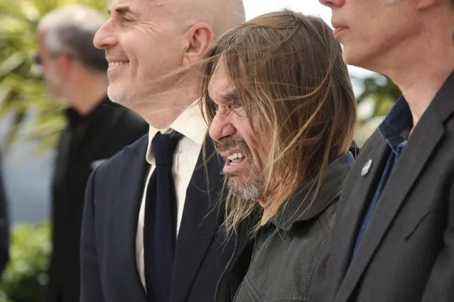 Singer Iggy Pop, centre, poses for photographers during a photo call for the film Gimme Danger at the 69th international film festival, Cannes, southern France, Thursday, May 19, 2016. (Photo by Joel Ryan/AP Photo)