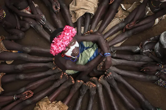 “Kids in Holiday”. In south of Ethiopia i find Karo Tribe in Omo Valley... alots of children playing together!! Making foots together someone set in the center!! Photo location: Karo Tribe, Omo Valley, Ethiopia. (Photo and caption by Hesham Alhumaid/National Geographic Photo Contest)