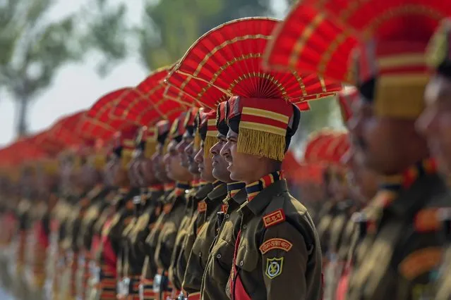 Indian Border Security Force (BSF) new recruits take part in a passing out parade in Humhama on the outskirts of Srinagar on April 4,2022. (Photo by Tauseef Mustafa/AFP Photo)