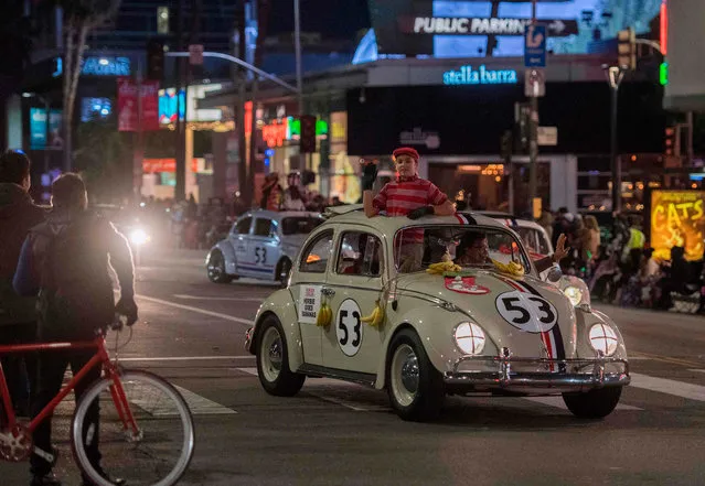 Cars from the “Herbie” movies are driven down Sunset Blvd during the 88th annual Hollywood Christmas Parade in Hollywood, California on December 1, 2019. (Photo by Mark Ralston/AFP Photo)