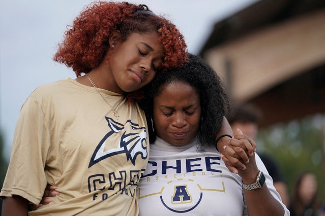 Women cry while attending a vigil at Jug Tavern Park following a shooting at Apalachee High School in Winder, Georgia on September 4, 2024. (Photo by Elijah Nouvelage/Reuters)