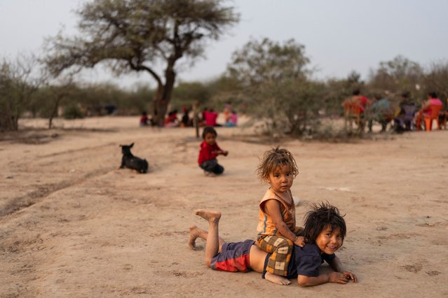 Manjui Indigenous children eye the camera while playing in the Abisai community in Mariscal Estigarribia, in the western region of Paraguay known as the Paraguayan Chaco, Wednesday, August 28, 2024. (Photo by Rodrigo Abd/AP Photo)