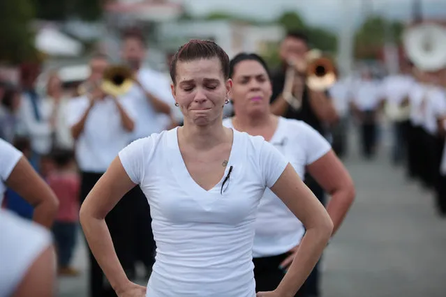 Members of a school band perform during the funeral of Angel Candelario, one of the victims of the shooting at the Pulse night club in Orlando, after he was flown in from Florida to be buried, in his hometown of Guanica, Puerto Rico, June 17, 2016. (Photo by Alvin Baez/Reuters)