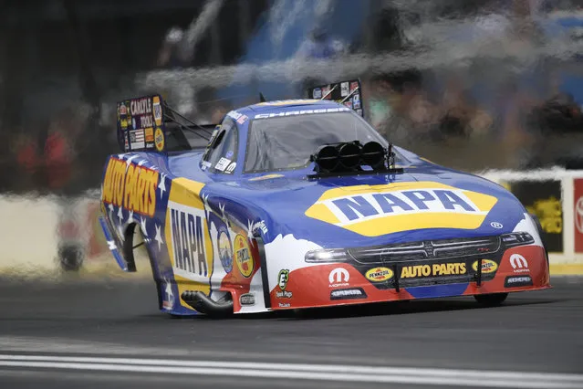 In this photo provided by NHRA, points leader Ron Capps locks down his sixth victory of the season in the final round at the annual Fallen Patriots NHRA Route 66 Nationals in Joliet, Ill., Sunday, July 9, 2017. (Photo by Jerry Foss/NHRA via AP Photo)