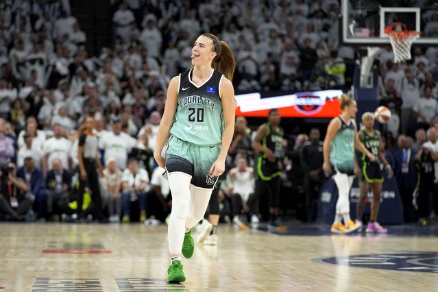 New York Liberty guard Sabrina Ionescu celebrates after making a 3-point basket during the second half against the Minnesota Lynx in Game 3 of a WNBA basketball final playoff series, Wednesday, October 16, 2024, in Minneapolis. The Liberty won 80-77. (Photo by Abbie Parr/AP Photo)