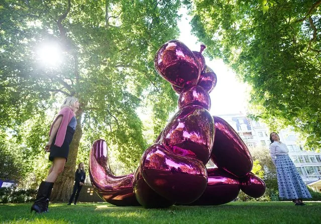 Artist Jeff Koons sculpture Balloon Monkey (Magenta), 2006-13, with an estimate of £6,000,000-10,000,000 on display in St James's Square, London, before being sold by Christie's to raise funds for humanitarian aid for Ukraine. Picture date: Tuesday June 14, 2022. (Photo by Yui Mok/PA Images via Getty Images)