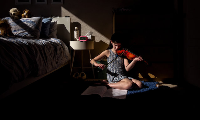 Photographer of the year second place. “Girl with the Violin”. Location: Colorado, US. Shot on iPhone 13 Pro. United States. (Photo by Kelly Dallas/Courtesy of the artist and IPPAWARDS)
