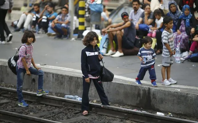 Migrants wait on a platform for a train at the Keleti train station in Budapest, Hungary, September 3, 2015. (Photo by Leonhard Foeger/Reuters)