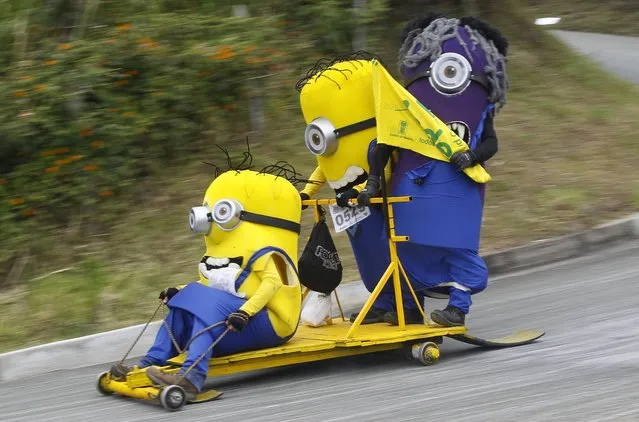 Participants descend a hill on a homemade cart during the 26th Roller Cart Festival in Medellin, Colombia September 6, 2015. (Photo by Fredy Builes/Reuters)