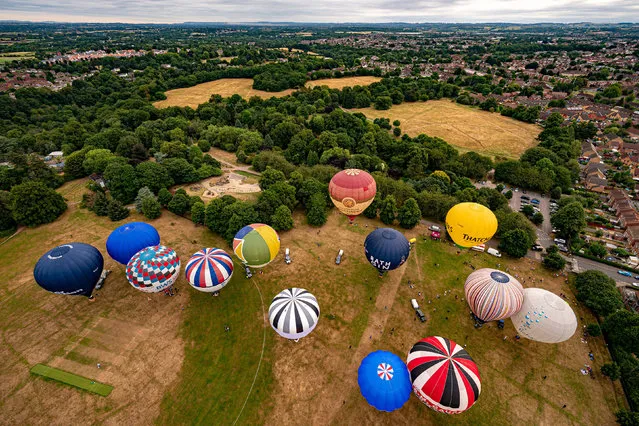 Balloons prepare to take off for a flight over Bristol, ahead of the Bristol International Balloon Fiesta 2022 on Monday, August 1, 2022. (Photo by Ben Birchall/PA Wire)