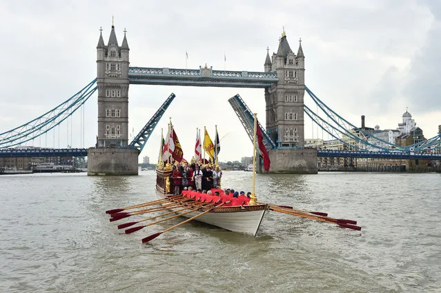 A Royal River Salute sails under Tower Bridge to celebrate Queen Elizabeth II becoming the longest reigning British monarch, in London, Wednesday, September 9, 2015. The Queen on Wednesday became the longest ever reigning monarch in British history surpassing Queen Victoria who served for 63 years and seven months. (Photo by Dominic Lipinski/PA via AP Photo)