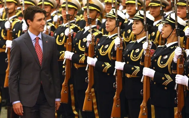 Canadian Prime Minister Justin Trudeau inspects a military honor guard during a welcoming ceremony at the Great Hall of the People in Beijing on December 4, 2017. Trudeau began a trip to China on Monday focused on trade with a stop at China's social media giant Sina, where he talked up the advantages of traveling to Canada. (Photo by Stephen Shaver/UPI/Barcroft Images)