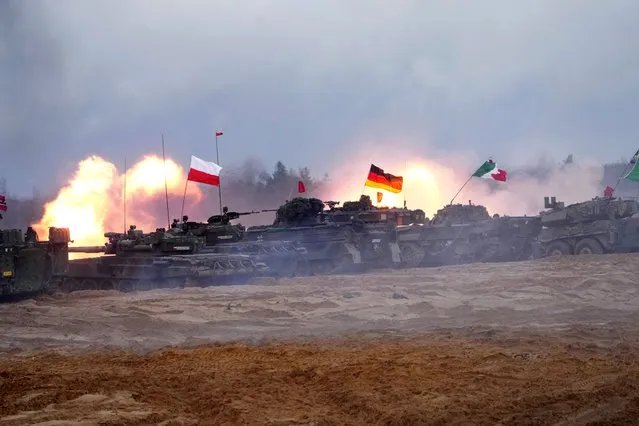 Polish PT-91 Twardy, German Leopard 2 and Italian Ariete tanks of NATO Enhanced Forward Presence battle groups attend live fire exercise, during Iron Spear 2022 military drill in Adazi, Latvia on November 15, 2022. (Photo by Ints Kalnins/Reuters)
