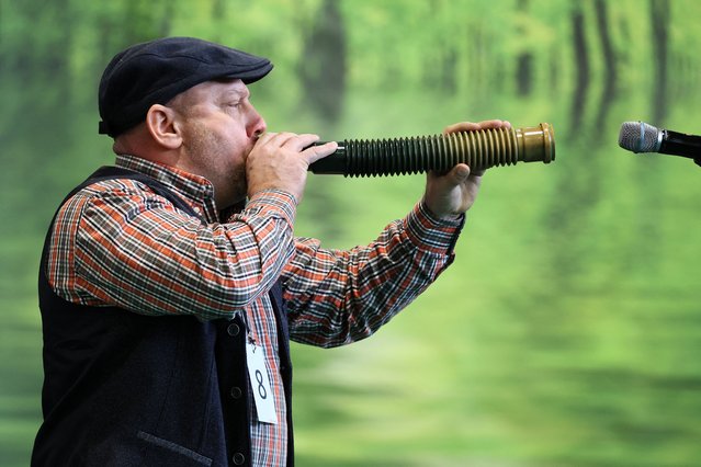 Enrico Braun imitates a male deer call with an outlet pipe during the German deer-calling championships in which 16 competitors jostled for the best imitation of a male deer call, a hunting trick that has been used for centuries, in Dortmund, Germany on February 2, 2024. (Photo by Wolfgang Rattay/Reuters)