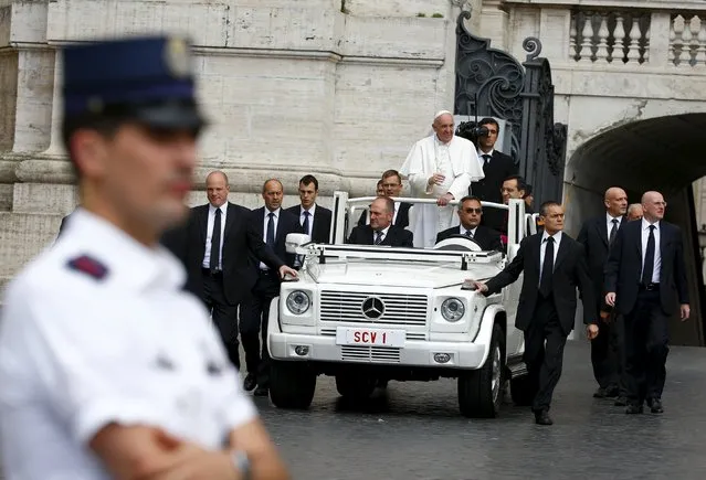 Pope Francis waves as he arrives to lead the weekly audience in Saint Peter's Square at the Vatican October 7, 2015. (Photo by Tony Gentile/Reuters)