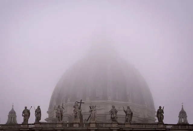 A photograph shows St Peter's Basilica under fog in The Vatican on November 17, 2022. (Photo by Tiziana Fabi/AFP Photo)