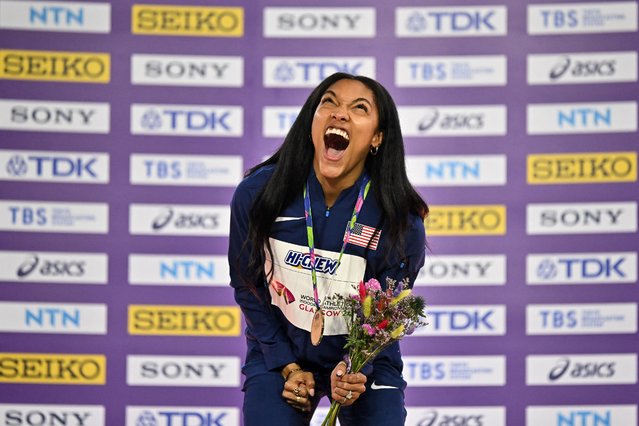 Gold medallist USA's Tara Davis-Woodhall celebrates on the podium after competing in the Women's Long Jump final during the Indoor World Athletics Championships in Glasgow, Scotland, on March 3, 2024. (Photo by Ben Stansall/AFP Photo)