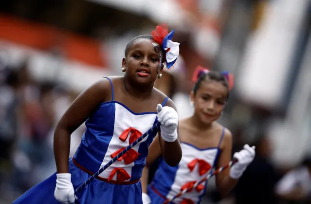 Two students dance during a parade to commemorate Costa Rica's Independence Day in San Jose, Costa Rica, September 15, 2016. (Photo by Juan Carlos Ulate/Reuters)