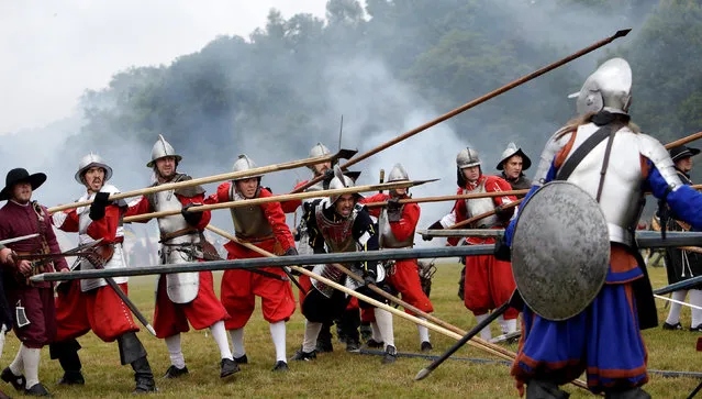 Participants wearing medieval costumes re-enact the 1620 battle of Bila Hora (Battle of White Mountain) between Bohemian Estates and Austrian Imperial with Catholic forces in Prague, Czech Republic September 18, 2016. The Battle of White Mountain was an early battle in the Thirty Years' War fought on 8 November 1620 (New Style calendar), in which an army of 15,000 Bohemians and mercenaries under Christian of Anhalt were defeated by 27,000 men of the combined armies of Ferdinand II, Holy Roman Emperor, under Charles Bonaventure de Longueval, Count of Bucquoy and the German Catholic League under Johann Tserclaes, Count of Tilly at Bílá Hora (“White Mountain”), near Prague (now part of the city). The battle marked the end of the Bohemian period of the Thirty Years' War and decisively influenced the fate of the Czech lands for the next 300 years. (Photo by David W. Cerny/Reuters)