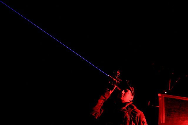 A serviceman from the mobile air defence unit of the 115th Separate Mechanized Brigade of the Ukrainian Armed Forces observes the sky during an overnight shift, amid Russia's attack on Ukraine, in Kharkiv Region, Ukraine on June 1, 2025. (Photo by Sofiia Gatilova/Reuters)