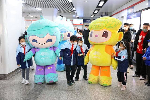 The mascots for the 19th Asian Games Hangzhou 2022 take the subway in Hangzhou City, east China's Zhejiang province, 18 January, 2023. (Photo by Rex Features/Shutterstock)