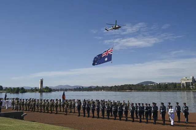 Seahawk SH-60R Helicopter flyover on January 26, 2023 in Canberra, Australia.  Australia Day, formerly known as Foundation Day, is the official national day of Australia and is celebrated annually on January 26 to commemorate the arrival of the First Fleet to Sydney in 1788. Many indigenous Australians refer to the day as 'Invasion Day' and there is a growing movement to change the date to one which can be celebrated by all Australians. (Photo by Martin Ollman/Getty Images)