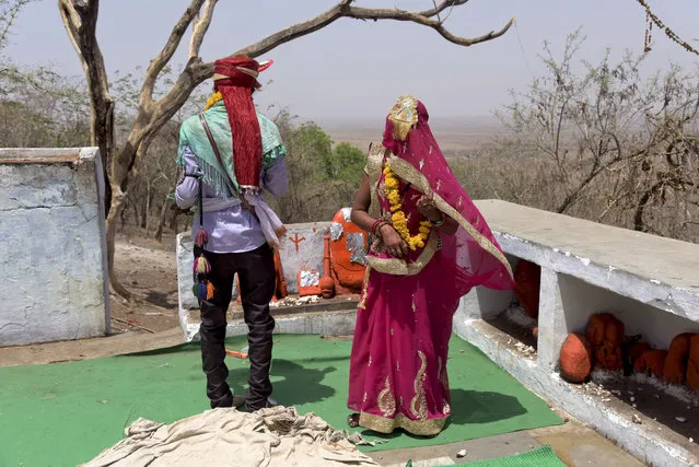 In this April 17, 2017 photograph, a child bride, who is only fourteen years old, right, performs rituals with the groom after getting married at a Hindu temple near Rajgarh, Madhya Pradesh state, India. A significant fall in child marriages in South Asia has reduced the rate of marriage for girls globally, the U.N. children's agency said Tuesday. (Photo by Prakash Hatvalne/AP Photo)