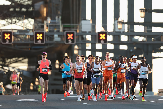 Competitors run across the Sydney Harbour Bridge during the 2025 Sydney Marathon on August 31, 2025 in Sydney, Australia. (Photo by Cameron Spencer/Getty Images)